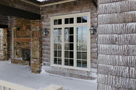 Eco-friendly exterior bark wall covering looks great with some snow