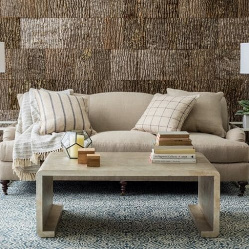 Annie Selke, Pine Cone Hill, uses Bark House Poplar Bark interior shingles for a beautiful backdrop to rugs: blue rug