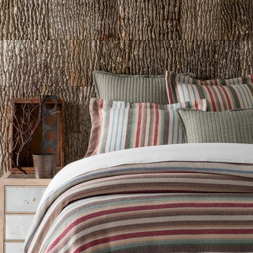Annie Selke, Pine Cone Hill, uses Bark House Poplar Bark interior shingles for a beautiful backdrop: red stripes