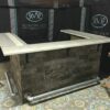 Bark House yellow poplar interior shingles create a textured subway tile kiosk for Anne Woodward