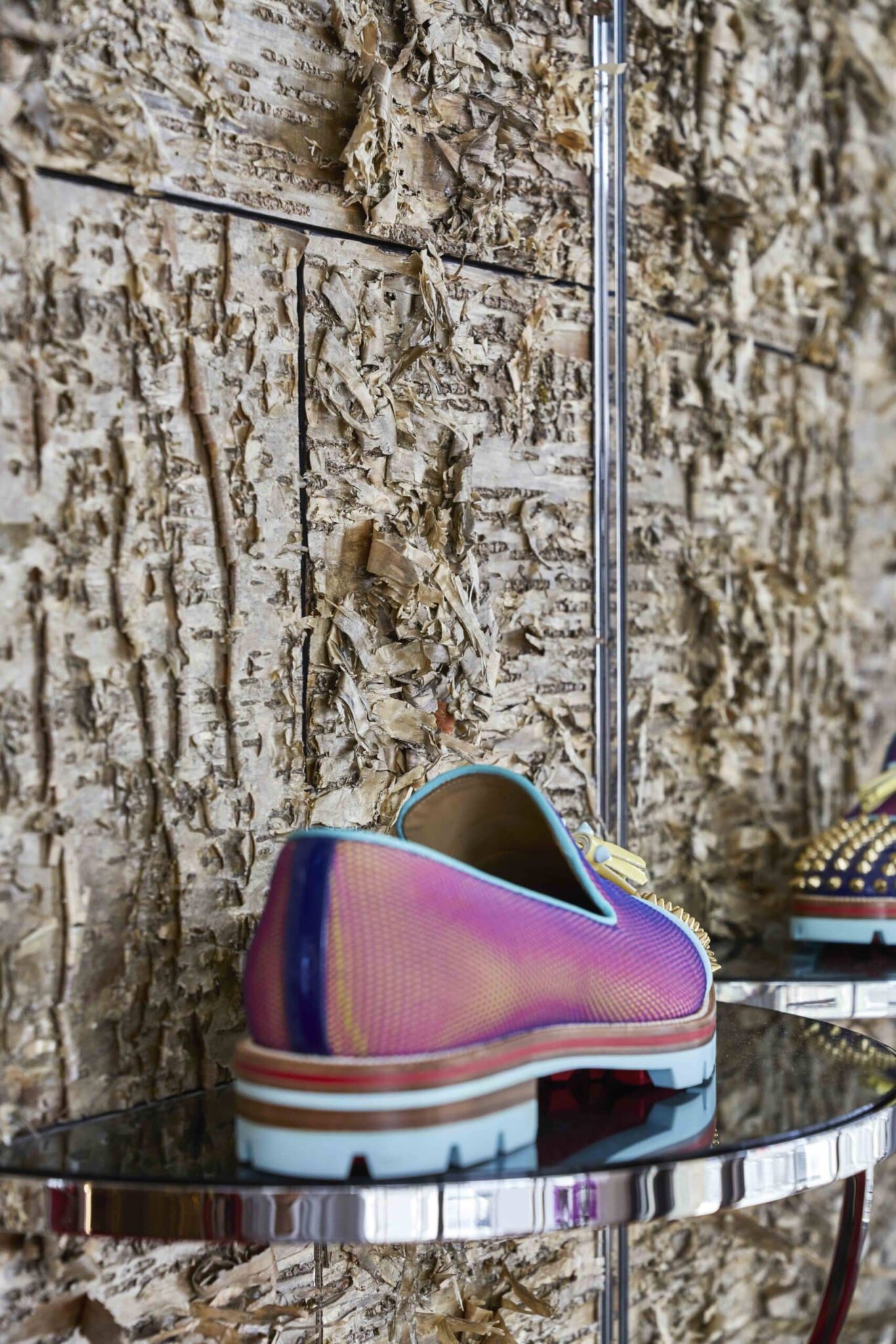 Christin Louboutin flat shoes show off nicely against Bark House gold birch wall coverings and panels