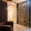 A Bark House Poplar Wall Panel acts as an accent piece - taking up a huge section of wall - in this study