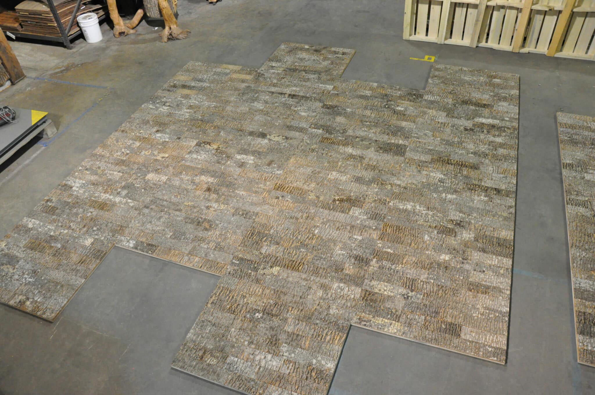 Laying out custom designed Bark House Poplar Subway Tiles Wall Panels