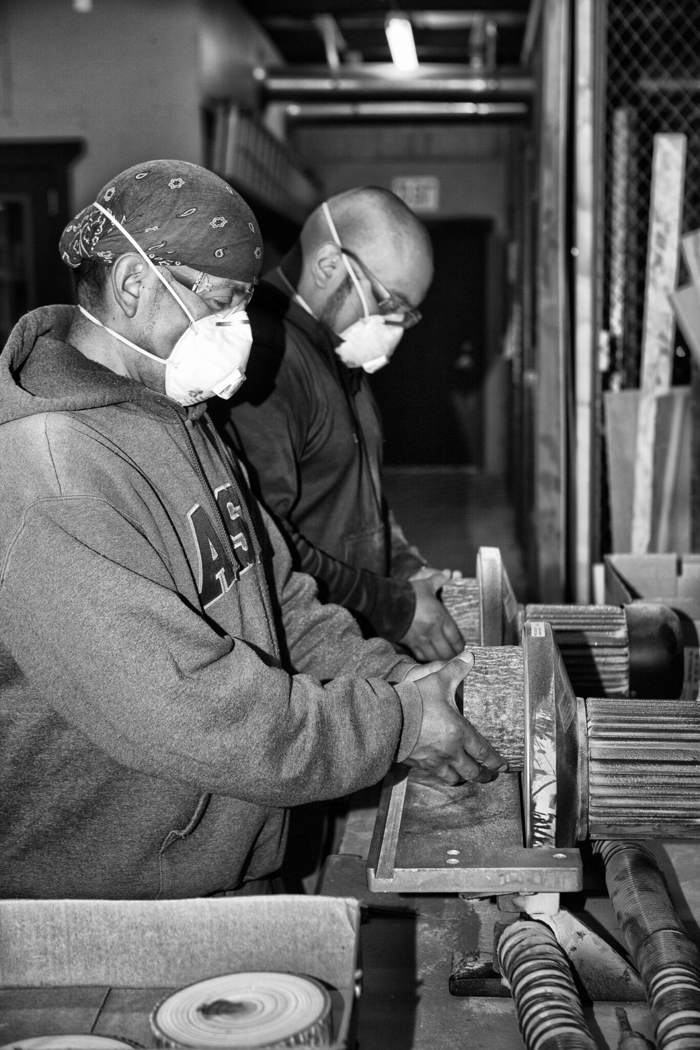 Bark House: sanding poplar pole end cuts for wall covering panels
