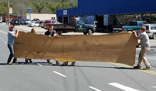 Bark House Live Edge Wood Slab on the move on main street Appalachia