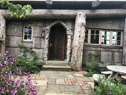 Bark House poplar exterior shingle siding on guest house in United Kingdom