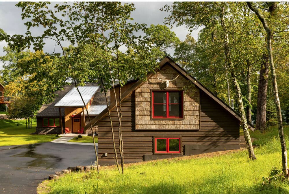 How to bring the family legacy of an old cabin home into a new one? Carry over key features of the old and wrap it up in bark siding to keep nature close.